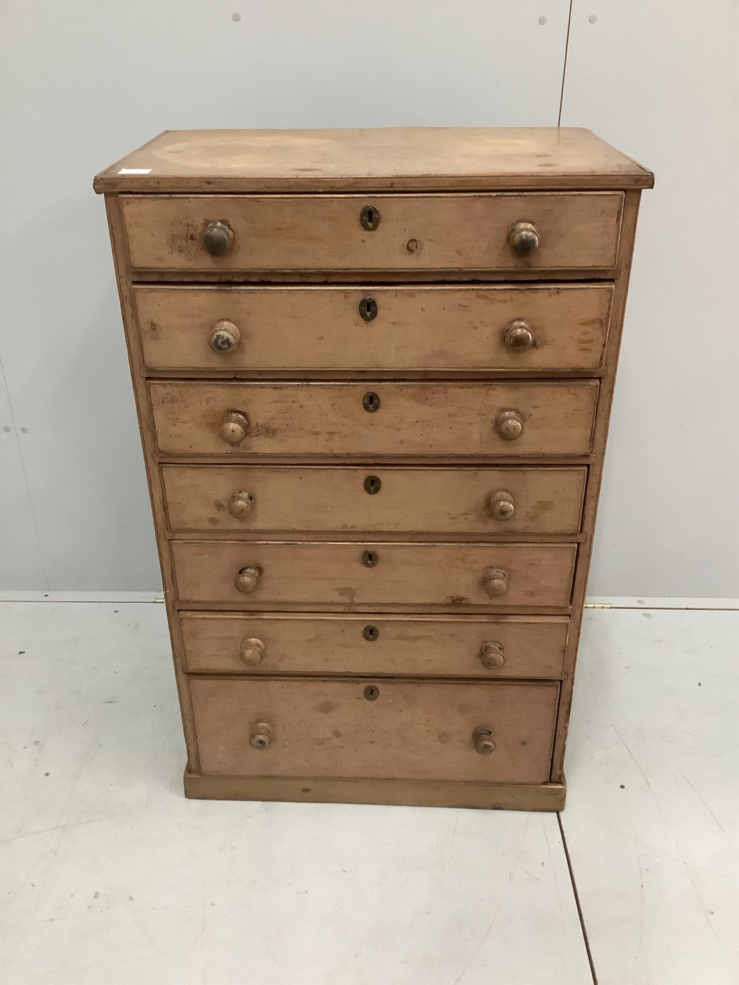 A French mid 19th century painted pine narrow chest of seven drawers, width 73cm, depth 44cm, height 117cm. Condition - fair